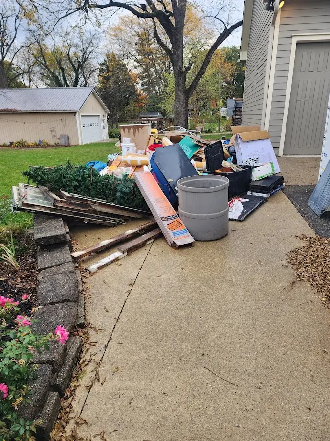 Dumpster being loaded with debris for Residential Dumpster Rental in Hickory